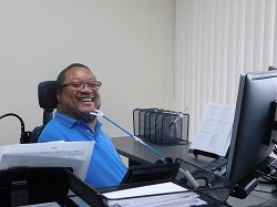 Andre Lewis working at his home health care agency.