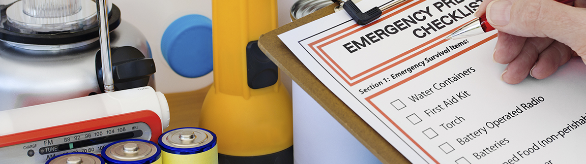 A checklist of emergency supplies next to several emergency supplies. Water Containers, First Aid Kit, Torch, Battery Operated Radio, Batteries, Canned Food.